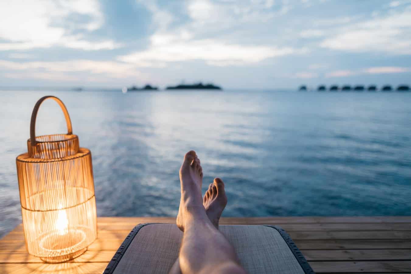 Someone on vacation relaxing by lake
