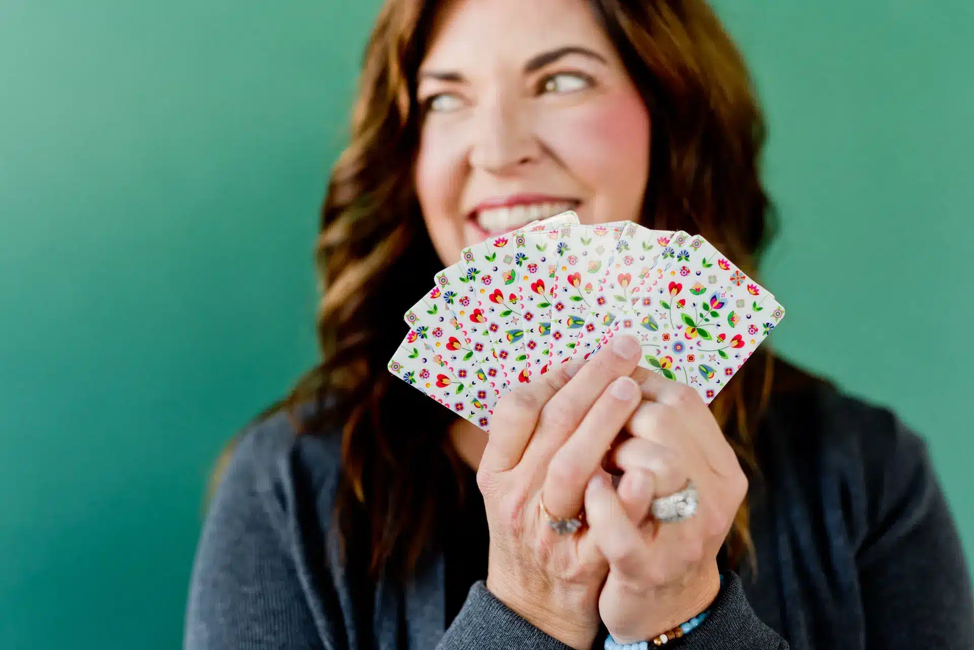 woman holding cards