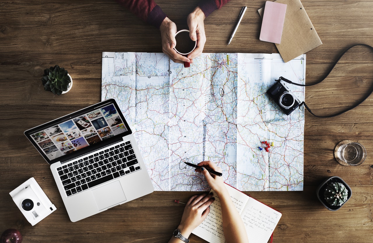People looking at a map planning a trip