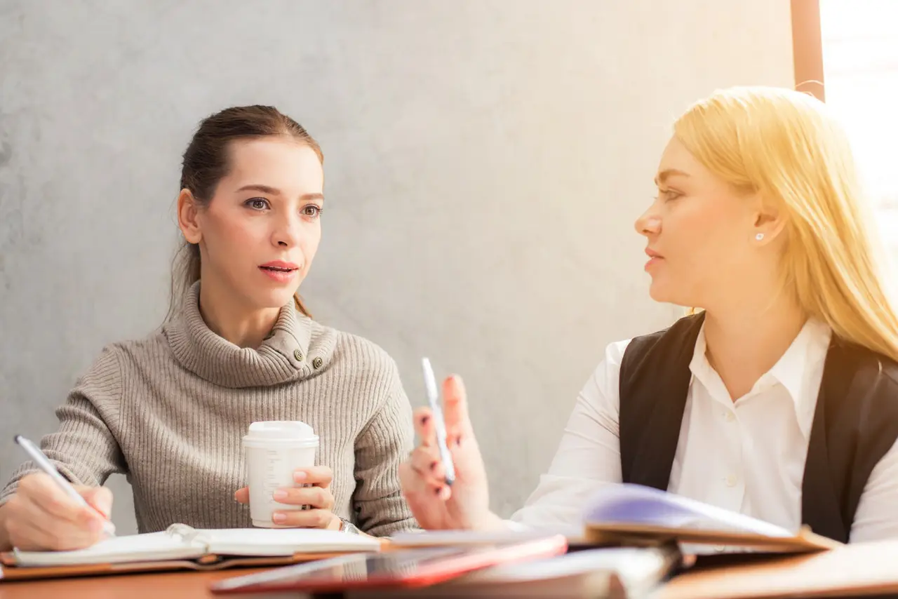 Two women working together