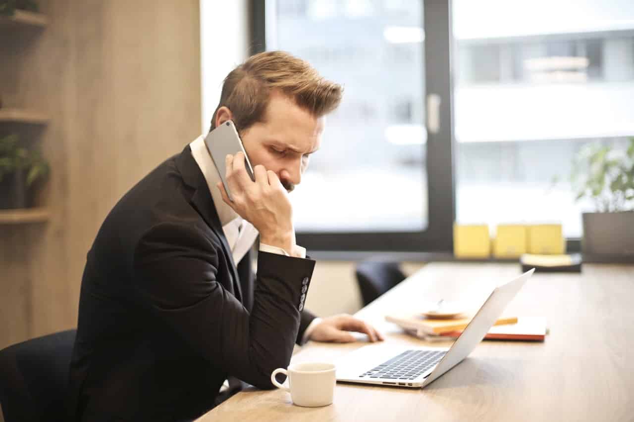 Man on top of a desk working